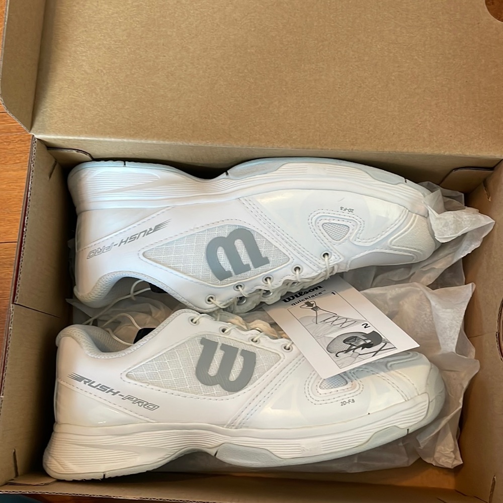 New!! Never worn kids size 3.5 white tennis shoes